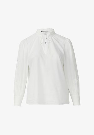 Biała bluzka z wysokim dekoltem i detalem ze sznurkiem. Posiada długie rękawy z haftowanymi wzorami kwiatowymi oraz marszczonymi mankietami.