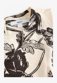 Valitud, cream and black floral print