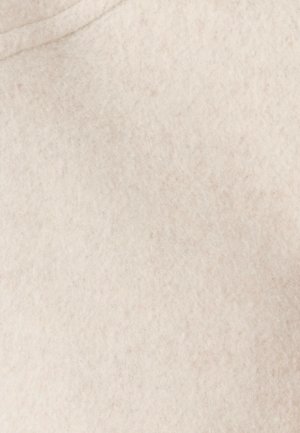 Tessuto di feltro beige chiaro con una texture morbida e fibrosa, caratterizzato da sottili variazioni di colore e una superficie liscia, adatto per artigianato o tappezzeria.