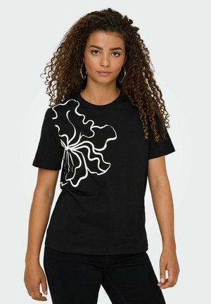 Zwarte katoenen t-shirt met een wit bloemontwerp aan de linkerkant. Rond de hals en korte mouwen met een relaxte pasvorm.