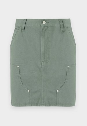 Green cotton skirt with a fitted design, featuring front pockets, smooth texture, and metal hardware accents at the pockets.