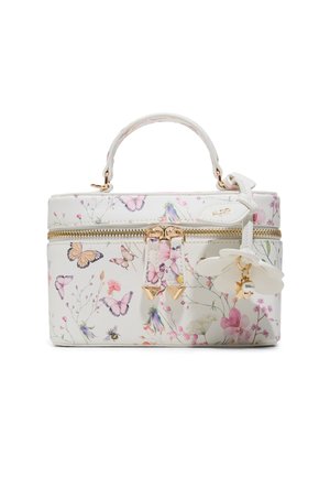 White rectangular handbag with floral and butterfly prints, gold zipper, top handle, and a white flower-shaped charm with gold accents.