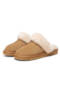 Tan suede slippers featuring a fluffy cream fur cuff, rounded toe shape, stitched detailing, and a rubber sole for grip.