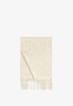 Coperta color crema con un sottile motivo leopardato, bordi frangiati, texture morbida e forma rettangolare. Dettagli sul materiale non specificati.