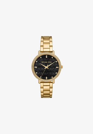 Kultainen Michael Kors -kello mustalla tekstuurilla varustetulla kellotaululla, kristallikoristuksilla ja siihen sopivalla kultaisella metalliketjuhihnalla. Pyöreä kotelo, jossa on logotiedot.