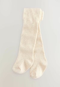 Collants côtelés de couleur crème avec une texture douce, présentant un design de pointe sans couture. Fabriqués en matériau extensible pour un port confortable.