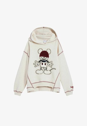 Kreminė džemperis su raudonais kontrastingais siūlais ir siuvinėta animacine pelėde, dėvinčia raudoną megztinį.