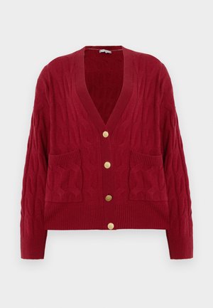 Red knitted cardigan with a cable pattern, V-neck, five gold buttons, and two front pockets. Ribbed cuffs and hem enhance texture.