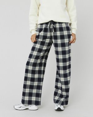 Pantalons en flanelle navy et blancs à coupe large et décontractée, avec un motif à carreaux et une taille élastique avec cordon.