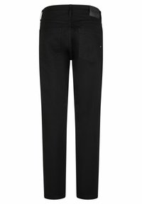 Jean noir à jambe droite vu de l'arrière avec deux poches arrière et une étiquette en cuir portant la marque sur la ceinture.