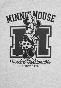 Maglietta grigia con una grafica in bianco e nero di un personaggio dei cartoni animati, con il testo "Minnie Mouse Fiera e alla Moda dal 1928" sotto.