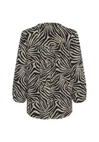 Haut rayé noir et beige en zèbre avec des manches longues, un col rond et des détails froncés au dos. Le tissu semble doux et léger.