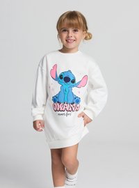 Felpa bianca a maniche lunghe con un personaggio dei cartoni animati blu dalle orecchie rosa, la scritta "OHANA significa famiglia" e polsini a coste sull'orlo.