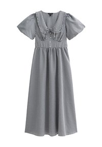 Robe vichy noir et blanc avec des manches bouffantes courtes, un décolleté large, une taille froncée et une jupe mi-longue. Présente un nœud au centre.
