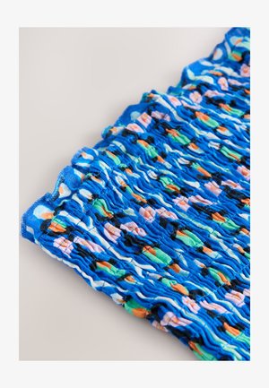 Blåt smockstof med et farverigt abstrakt mønster med orange, grønne og lyserøde accenter. Tekstureret med opsamlede sektioner og blød finish.