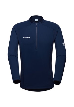 Navy blue quarter-zip pullover made from stretchy fabric, featuring a slight sheen, fitted design, and white logo on the chest and sleeve.