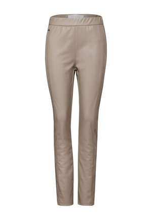 Leggings in ecopelle beige con vestibilità slim, caratterizzati da una texture liscia e cuciture laterali sottili per un tocco di dettaglio. Vita elastica.
