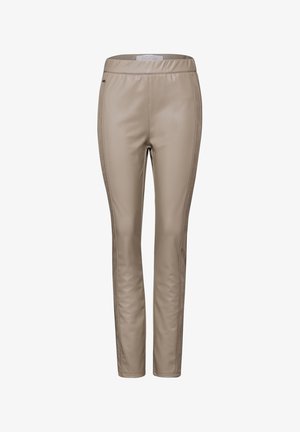 Leggings in ecopelle beige con vestibilità slim, caratterizzati da una texture liscia e cuciture laterali sottili per un tocco di dettaglio. Vita elastica.