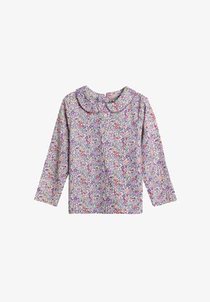 Bluza florală cu mâneci lungi, guler rotund și un model de flori violet, roz și verde pe un fundal deschis. Textură de țesătură moale.