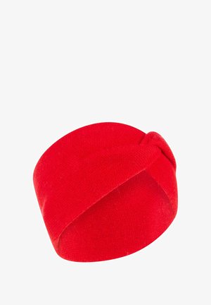 Red headband with a smooth, knitted texture. Features a twisted design and a solid color without patterns or additional accents.