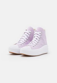 High-top sneakers in light lavender canvas with white laces, rubber toe cap, and a thick white platform sole. Features silver eyelets.
