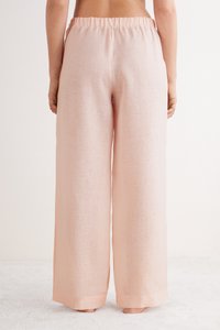 Lichtroze wijde linnen broek met een elastische tailleband, kenmerkend door een gestructureerde stof en een losvallend, vloeiend ontwerp.
