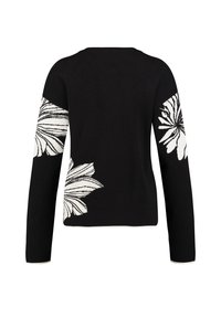 Schwarzer Pullover mit langen Ärmeln und weißen Blumenmustern an Schultern und Ärmeln. Der Stoff hat eine glatte Textur und gerippte Bündchen.