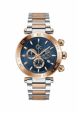 Chronografur med en blå tekstureret urskive, bånd i rosaguld og sølv rustfrit stål samt tre sub-urskiver. Har en tachymeter bezel.