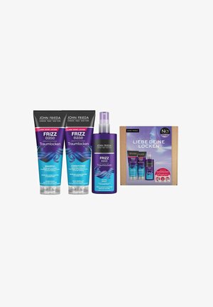 Tre prodotti per la cura dei capelli in tubetti e uno spray: due tubetti neri per shampoo e balsamo, e uno spray viola, tutti con accenti colorati. Scatola inclusa.