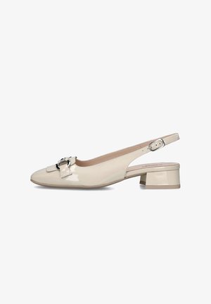 Beige patent leather slingback heels with a square toe, adjustable strap, and a decorative buckle on the vamp. Low block heel design.