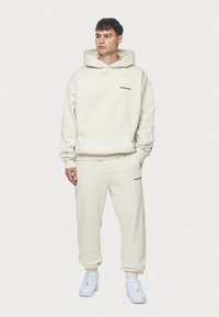 Pegador LOGO JOGGER - Træningsbukser - washed salty cream