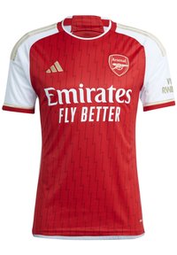 Red football jersey with white sleeves, gold accents, and a zigzag pattern. Features the Arsenal logo and “Emirates Fly Better” text.