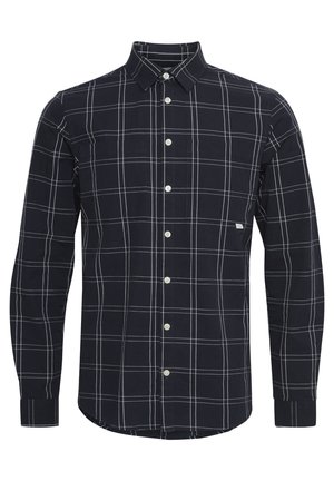 Tumes sinise ruudulise särk pikad varrukad valge ruudustikuga, klapiga krae, valged nupud ja kaks rinna taskut. Kangas on sileda tekstuuriga.