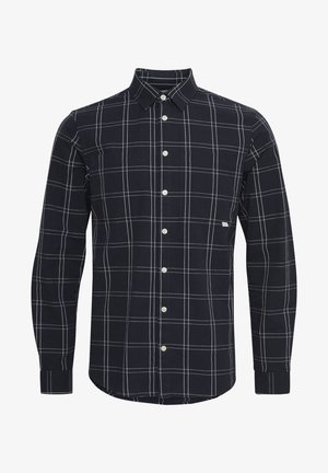 Tumes sinise ruudulise särk pikad varrukad valge ruudustikuga, klapiga krae, valged nupud ja kaks rinna taskut. Kangas on sileda tekstuuriga.