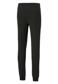 Svarta smalnande sweatpants i lätt tyg, med elastisk midja och en enda bakficka med dold stängning.