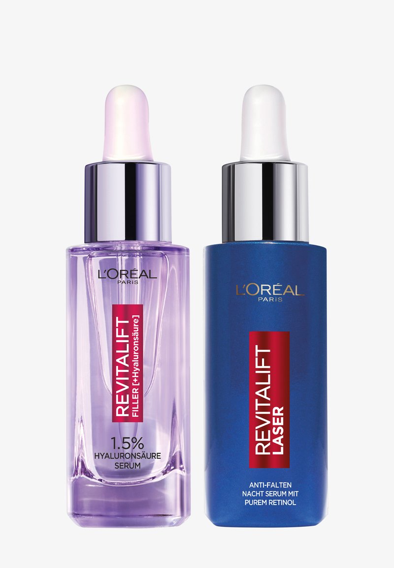 Deux sérums L'Oréal Revitalift avec bouchons compte-gouttes : un violet étiqueté 1,5 % de combleur à l'acide hyaluronique, un bleu étiqueté laser avec du rétinol pur.