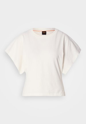 White cropped T-shirt, short wide sleeves, soft cotton material, round neckline with subtle orange trim, minimal design, no patterns or graphics.