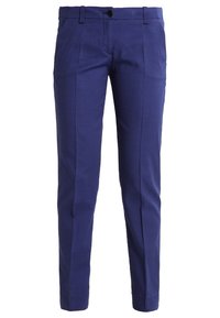 Blå byxor med en strukturerad mönster, slim fit, bälteshällor och framfickor. Tillverkade av lätt material, vilket ger en modern look.