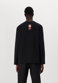 Marimekko BIITTI UNIKKO UNISEX - Topper langermet - black