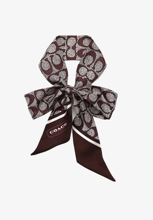Foulard di seta in bordeaux scuro e bianco, caratterizzato da un motivo astratto. Include un'etichetta con il logo "COACH" in un design rettangolare.