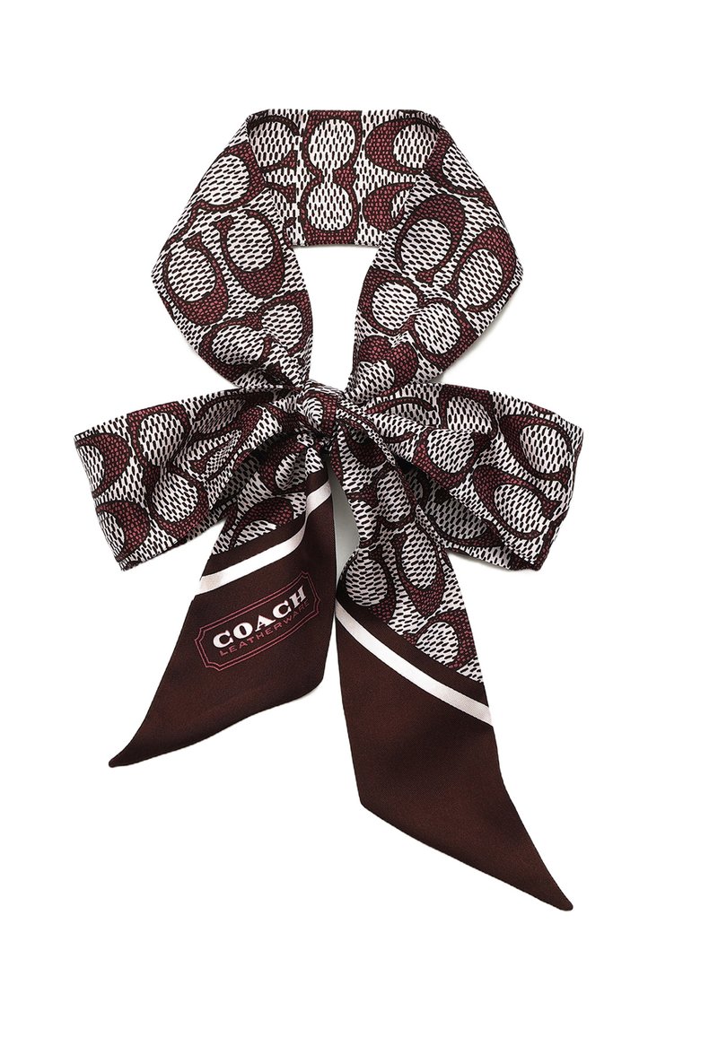 Foulard di seta in bordeaux scuro e bianco, caratterizzato da un motivo astratto. Include un'etichetta con il logo "COACH" in un design rettangolare.