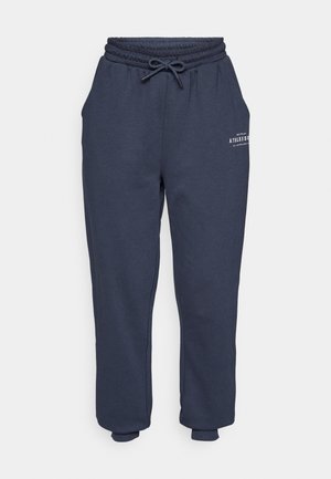 Mørkeblå joggebukser med elastisk midje og justerbar snor. Har sidelommer og en minimalistisk trykt logo foran.