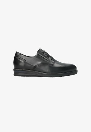 Chaussure habillée pour homme en cuir noir à lacets, semelle rembourrée et étiquette de la marque Mephisto sur le talon, vue de profil droit.