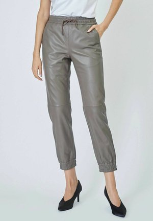 Gray leather jogger pants with an elastic waistband and cuffs, featuring side pockets and a drawstring for adjustable fit.