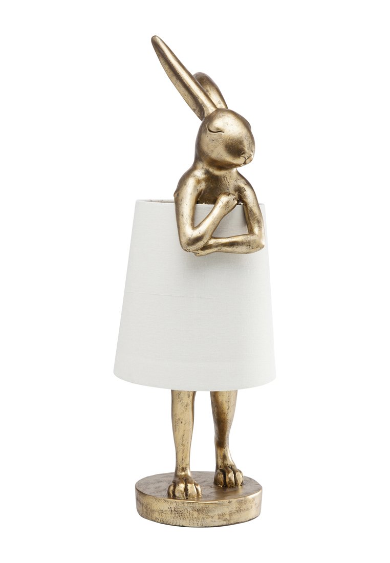 Lamptisch mit goldfarbenem Kaninchenkopf, das ausgestreckte Ohren und Arme hat, gekrönt von einem zylindrischen weißen Stoffschirm. Runder Fuß.