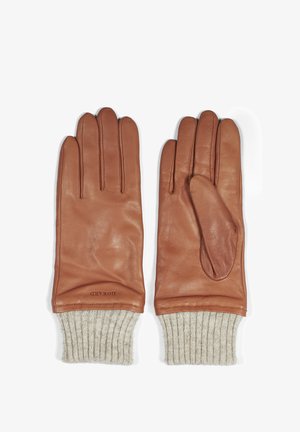 Braune Lederhandschuhe mit gerippten, beige Strickbündchen. Zu den Merkmalen gehören fünf Finger und ein einzigartiges Daumendesign für zusätzliche Wärme und Stil.