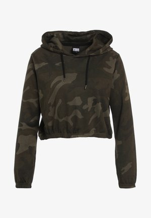 Lühendatud kapuutsiga pusa tume kamuflaažiga, millel on kohandatav kapuuts, pikad varrukad ja elastne äär. Valmistatud pehmest, tekstuuritud kangast.