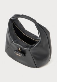 Black leather handbag with a rounded shape, a zip closure, and a short, sturdy handle. Features a small accent pocket. Smooth texture.