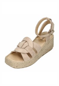 Beige espadrille wedge sandal with crisscross suede straps, open toe design, and jute-wrapped heel. Adjustable ankle strap features metal buckle.