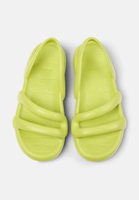 Green plastic sandals with two thick straps and a textured footbed for grip. Smooth finish with a minimalist design.